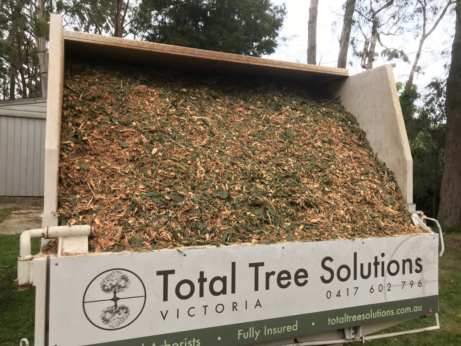 Fresh mulch loaded in a Total Tree Solutions truck