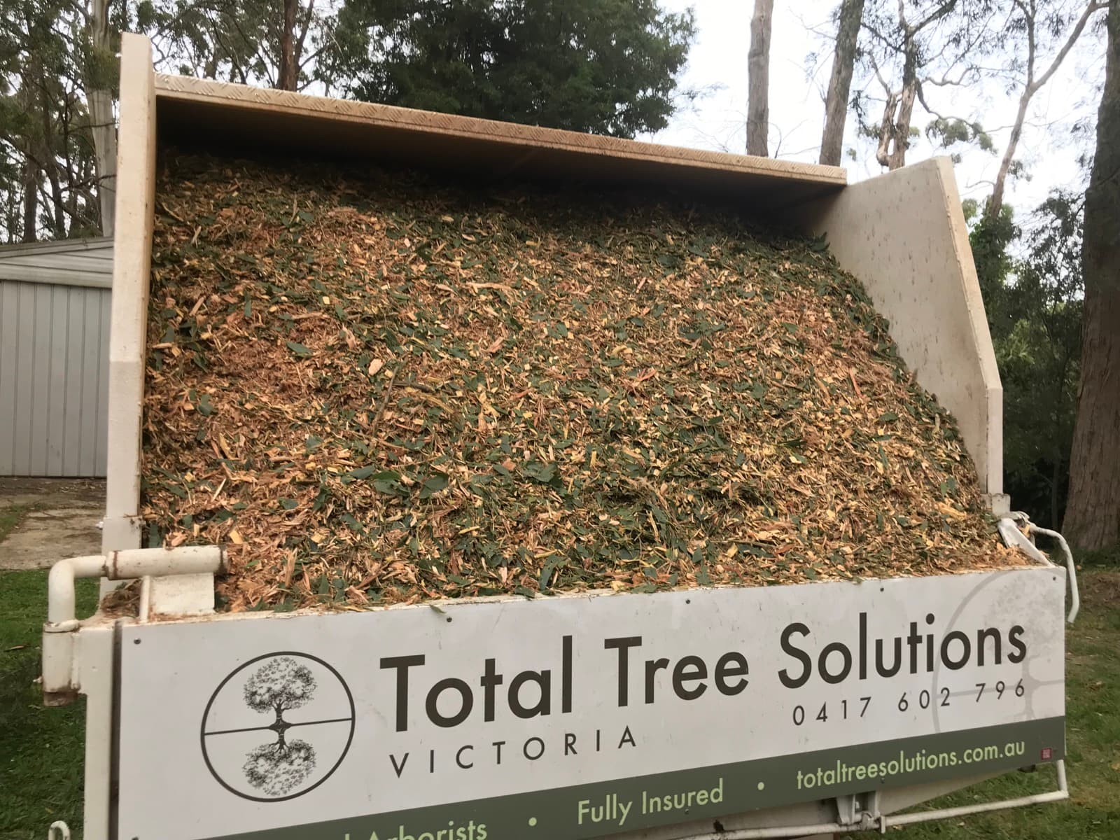 Fresh mulch loaded in a Total Tree Solutions truck